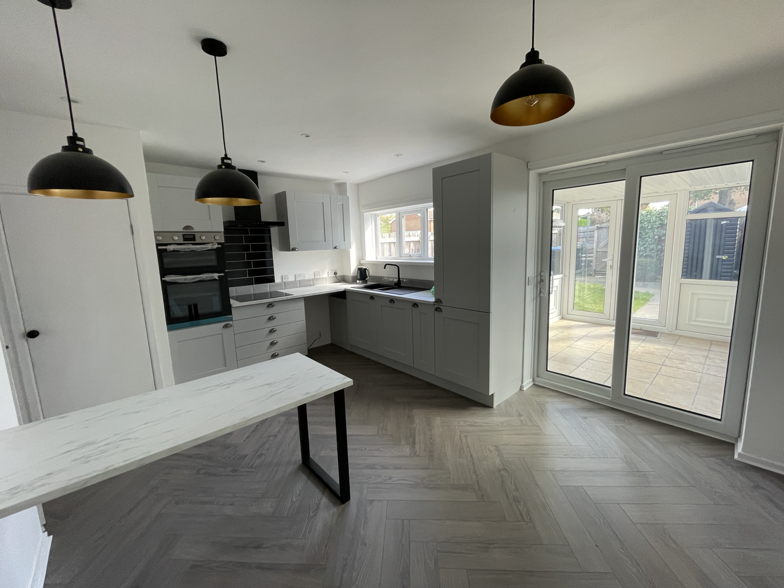 Kitchen and dining area with bi-fold doors